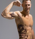 Dragon on Hip and Tribal on Bicep Tattoo Designs For Men