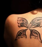 Birds Head Shaped Symbolizing Family Tattoo Design on Shoulder
