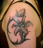 Lily Flower Shaped Symbolizing Family Tattoo Design Pic