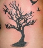 Tattoo Design of Dying Tree and Birds Rib Tattoos for Men
