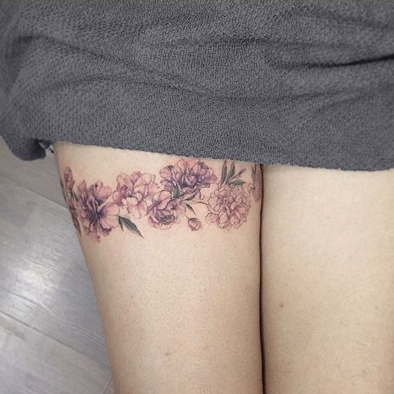 thigh garter flower tattoo