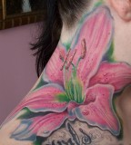 Pink and Green Lilly Tattoo on Right Shoulder