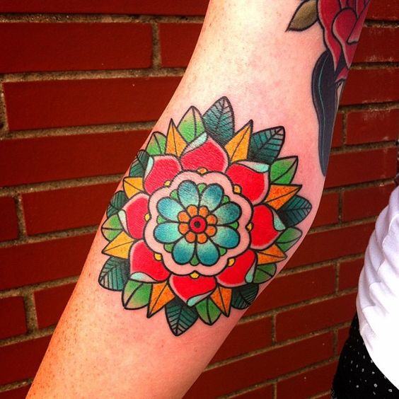 traditional flower tattoo on arm
