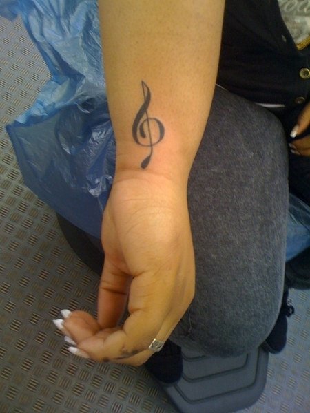Small and Cute Treble Clef Musical Tattoo on Inner Wrist