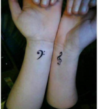 Simple Treble Clef Tattoo Symbol for Women Hand