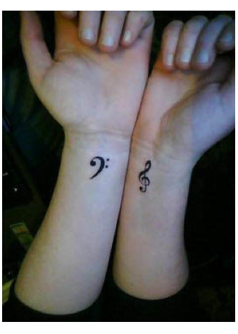 Simple Treble Clef Tattoo Symbol for Women Hand