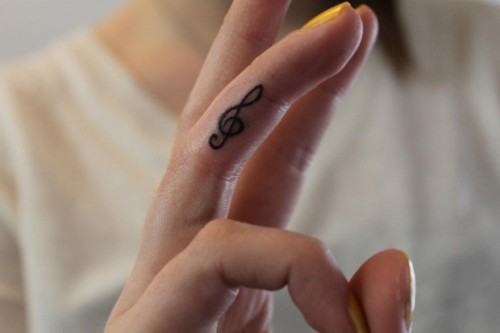 Treble Clef Tattoo on Hand for Women