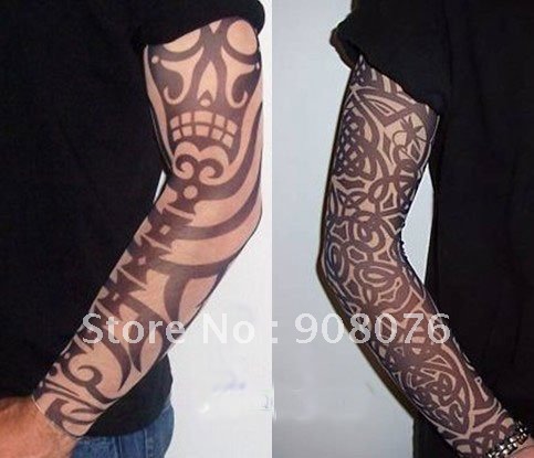 In Comparison: Arm Skull Theme And Full Tribal Tattoos