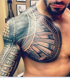tribal shoulder and chest tattoos for men