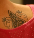 Artistic Back Swirly Trinity Knot Tattoo Design for Girls
