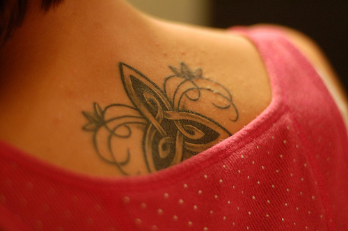 Artistic Back Swirly Trinity Knot Tattoo Design for Girls