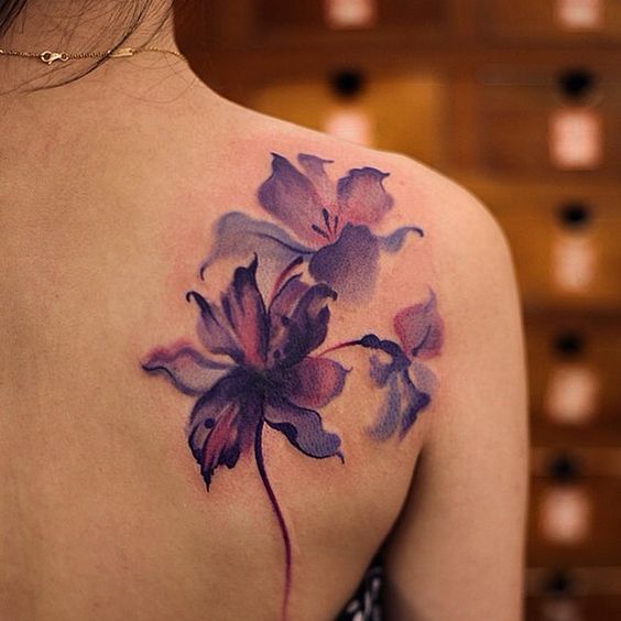 watercolor flower tattoo on shoulder