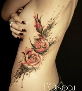 watercolor rose ribcage flower tattoo