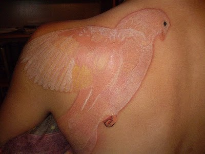 Cool Bird White Ink Tattoo On Upper Back