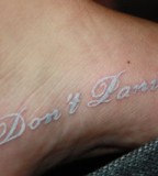 White Ink Tattoo On Girl Foot
