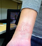 Swirl White Ink Tattoos On Hand For Girl 
