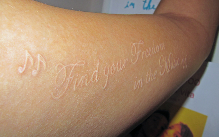 White Tattoos Lettering On Forearm