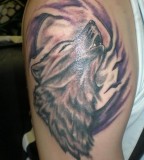 Wolf Haunting Tattoo On Bicep