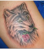 Wolf Biting Rose Tattoo Design For Men
